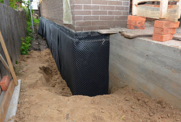 Happy homeowners after waterproofing job in Mosinee